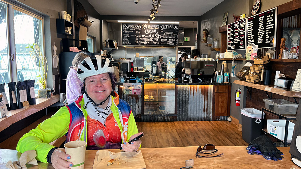 Kathy enjoying hot chocolate and a warm scone near Half Moon Bay